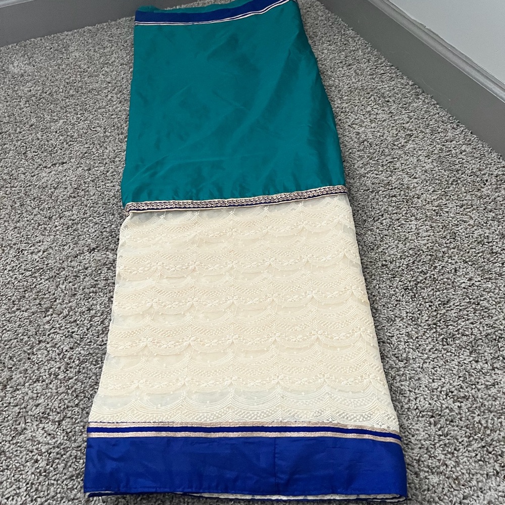 Elegant Teal and Cream Saree with Blue Border